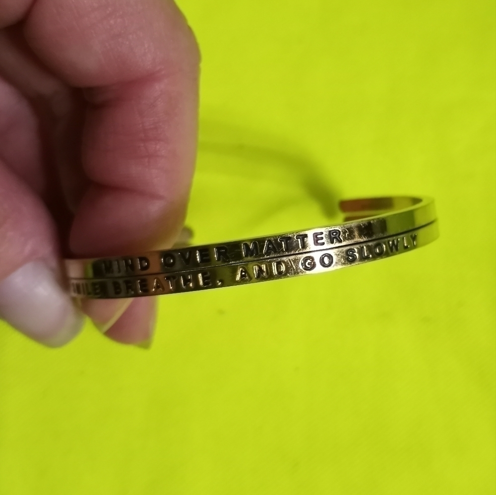 Pair cuff bracelets "mind over matter" & "smile, breath, and go slowly"